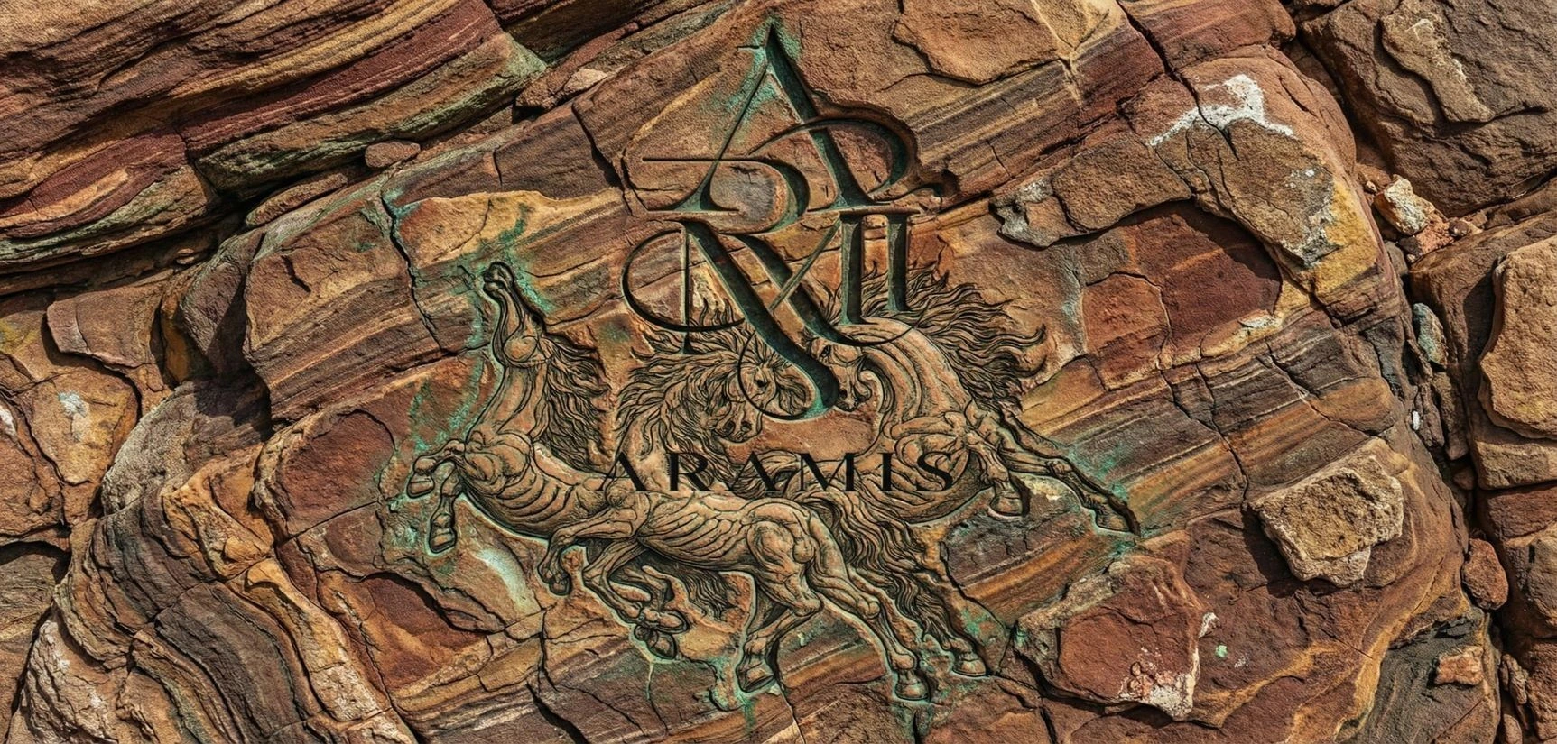 The Aramis crest carved into a textured material surface.