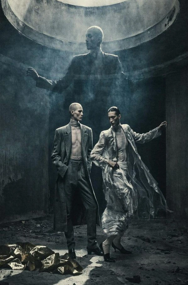 Two figures in a monumental circular space.