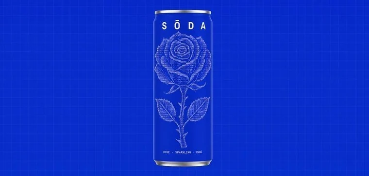 Botanical linework on a cobalt SŌDA can.