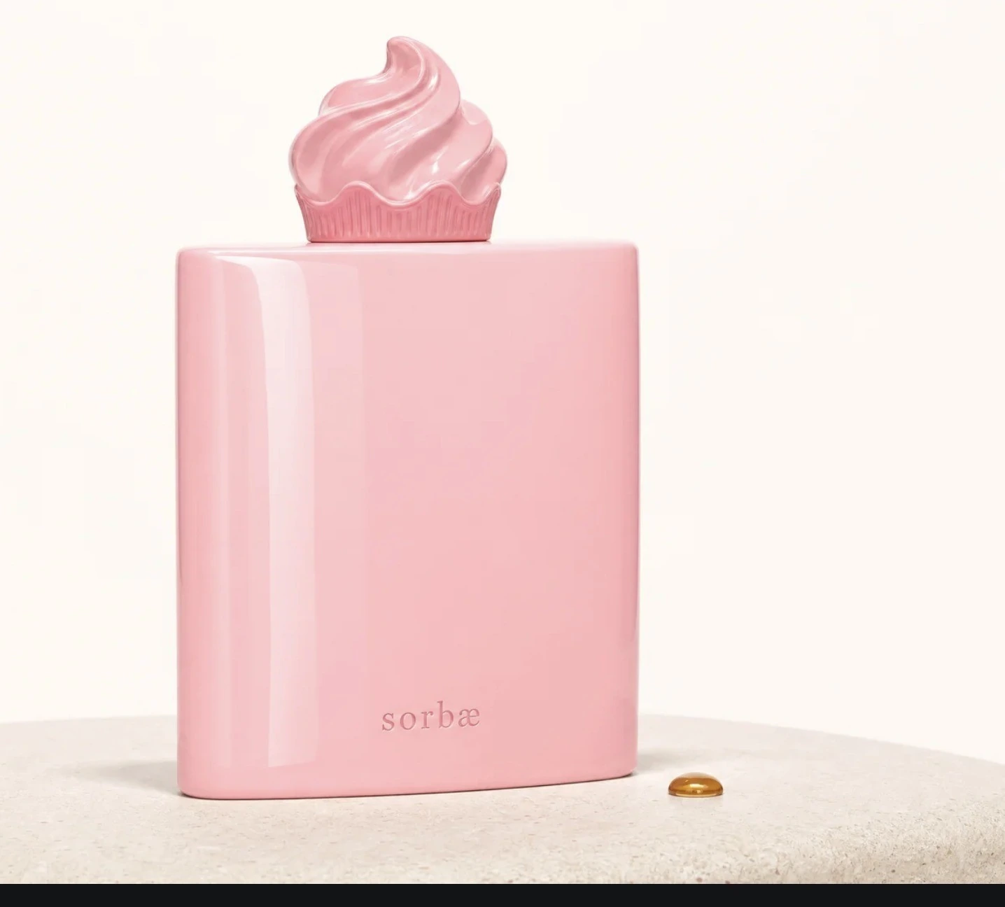 The sorbæ pink flask concept with a sculptural swirl cap.