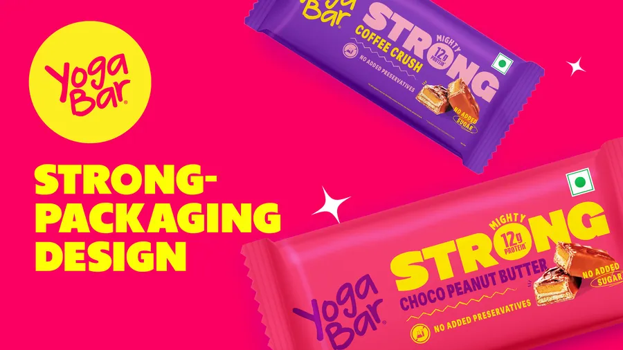 Yogabar Strong chocolate peanut butter packaging against chocolate and purple.